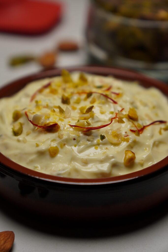 Close-up of Rajbhog Matho highlighting saffron strands, chopped nuts, and creamy hung curd texture