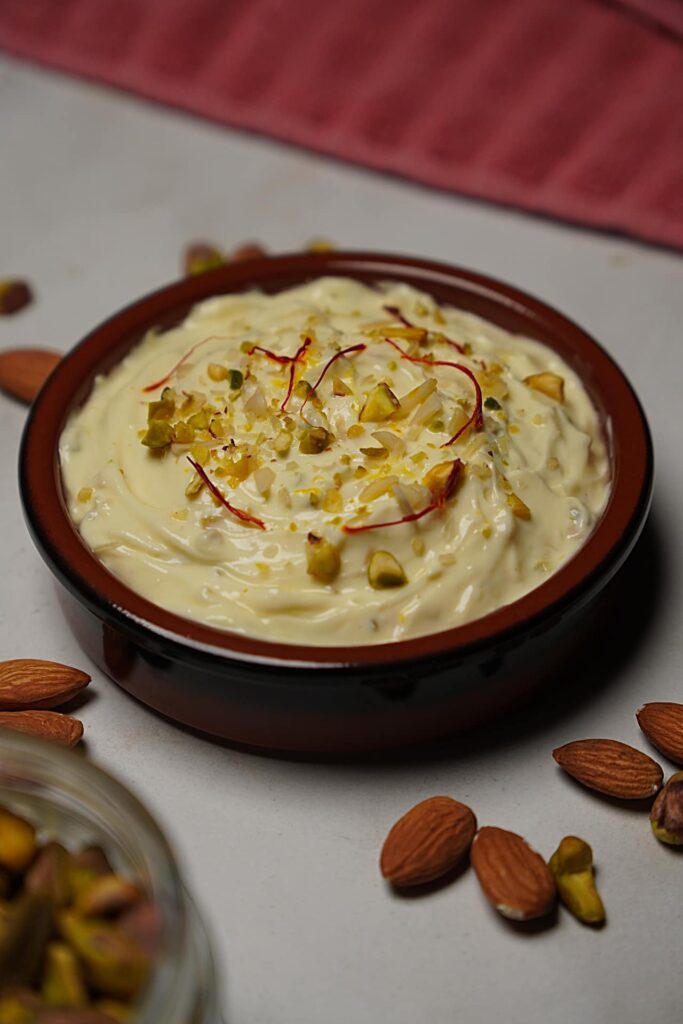 Overhead view of Rajbhog Matho showcasing creamy texture with saffron and nuts garnish