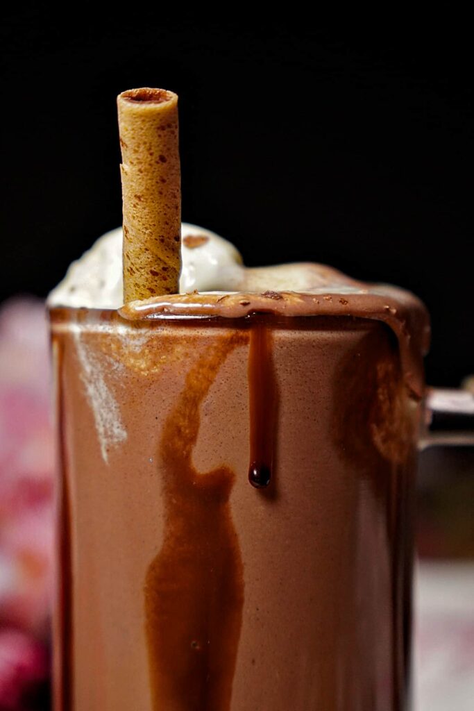 Close-up of Cold Coco, highlighting its thick consistency and inviting chocolate flavor.