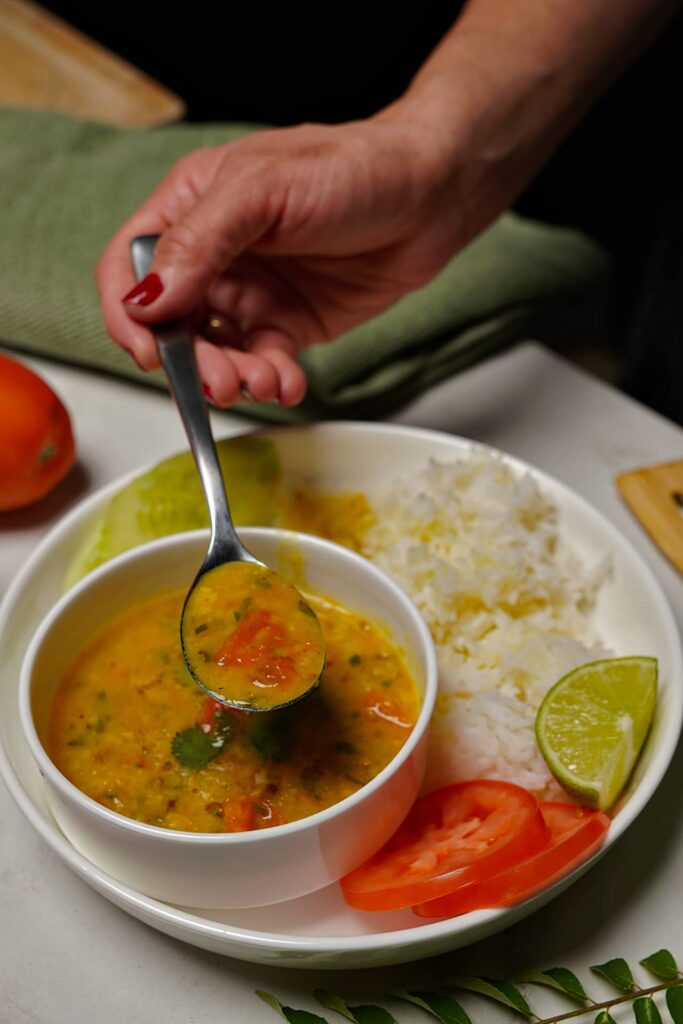 Delicious Jeera Tadka Wali Dal paired with fluffy rice, creating a comforting meal.
