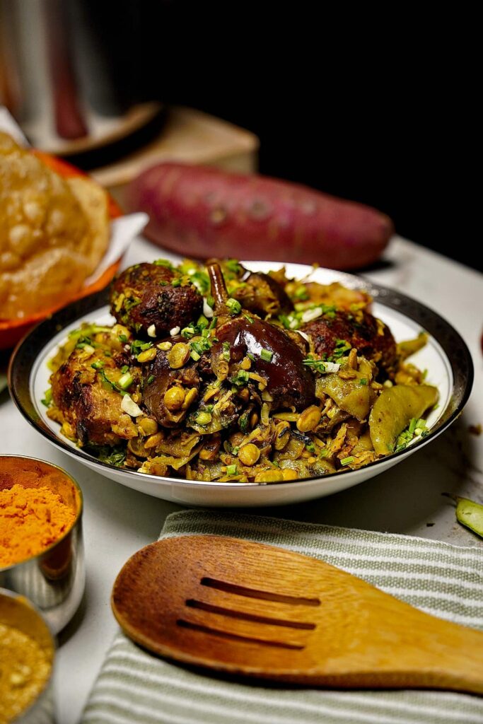 Gujarati winter vegetable casserole with a variety of seasonal vegetables and crispy fenugreek dumplings