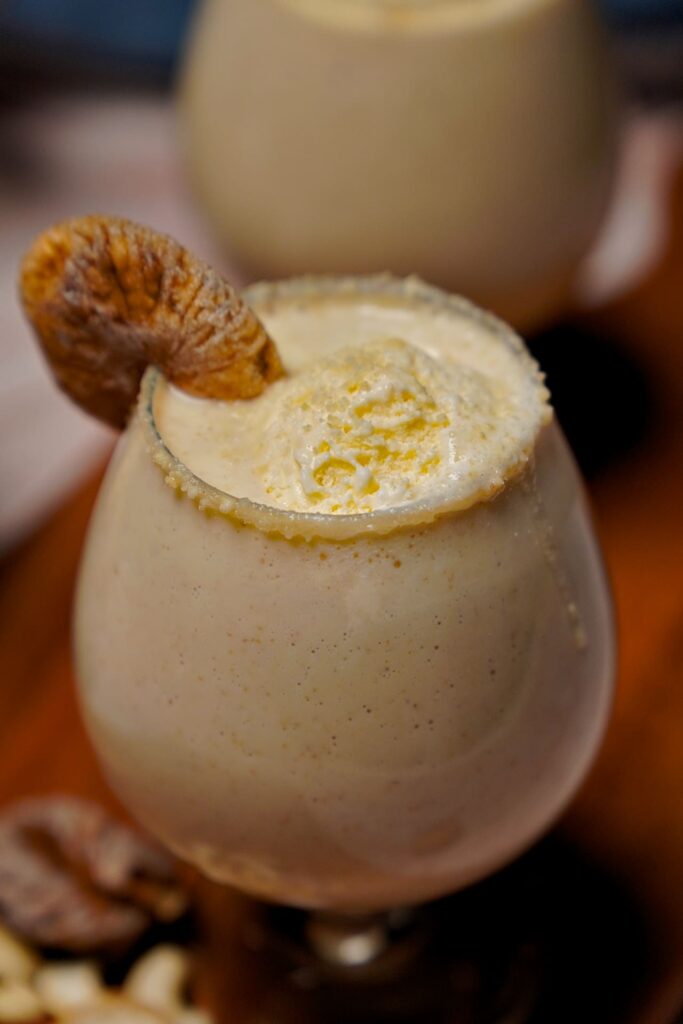Close-up of a Kaju Anjeer Milkshake showcasing its creamy texture and rich color.
